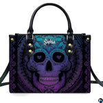 Turquoise violet sugar skull mandala handbag displayed alone on white background.