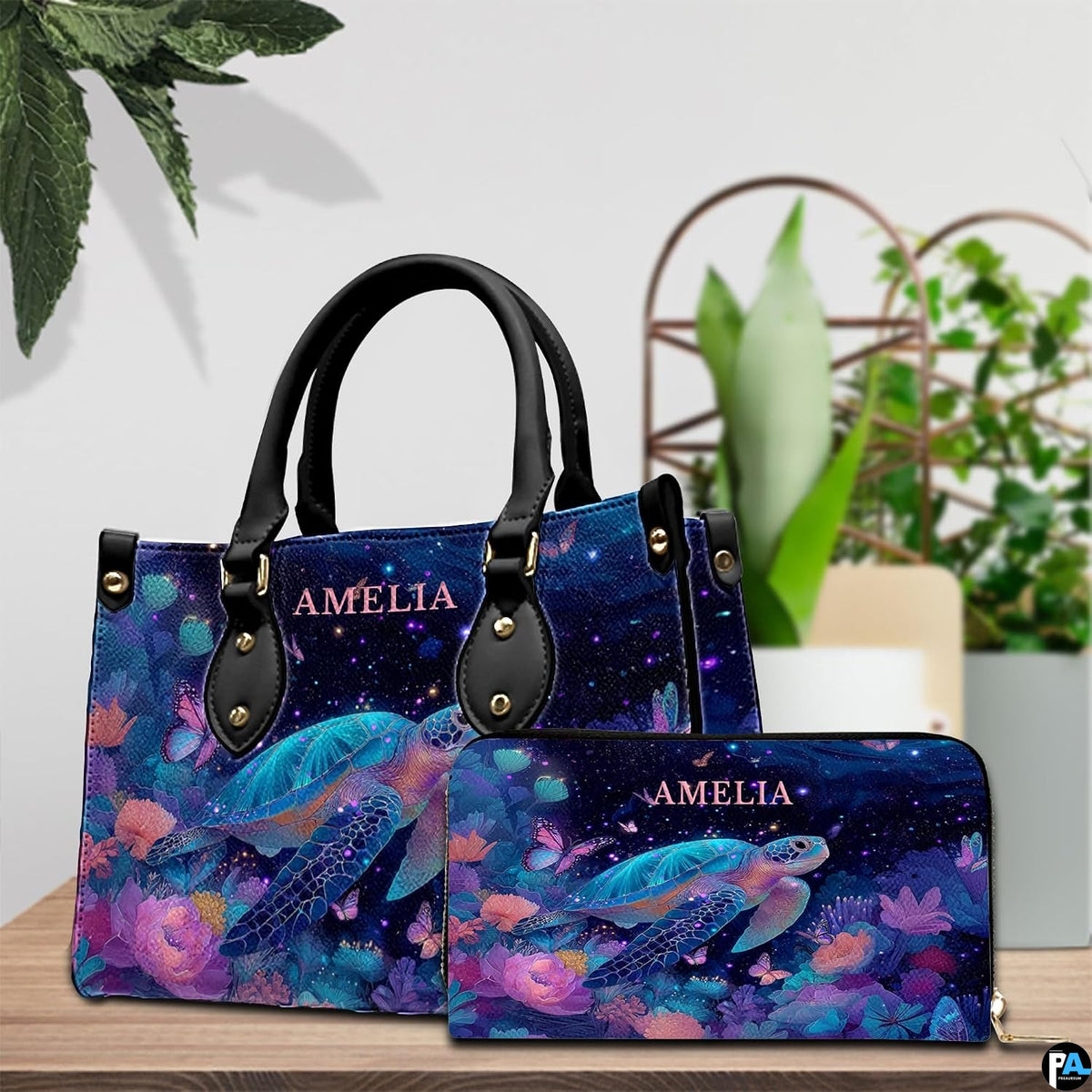 Lifestyle display showing the celestial sea turtle handbag worn over the shoulder.