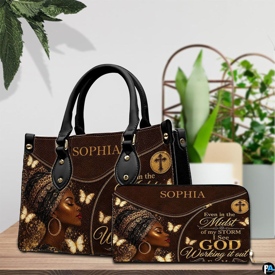 Angled brown portrait handbag with ornate headwrap, gold butterflies, and circular cross emblem