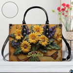 Close-up front view of matching zippered wallet showing daisy bouquet