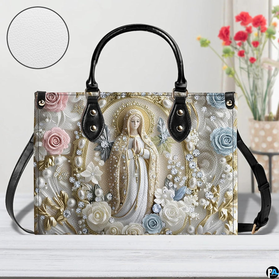 Tabletop display of pearl Madonna handbag showcasing pastel blossoms and golden leaves