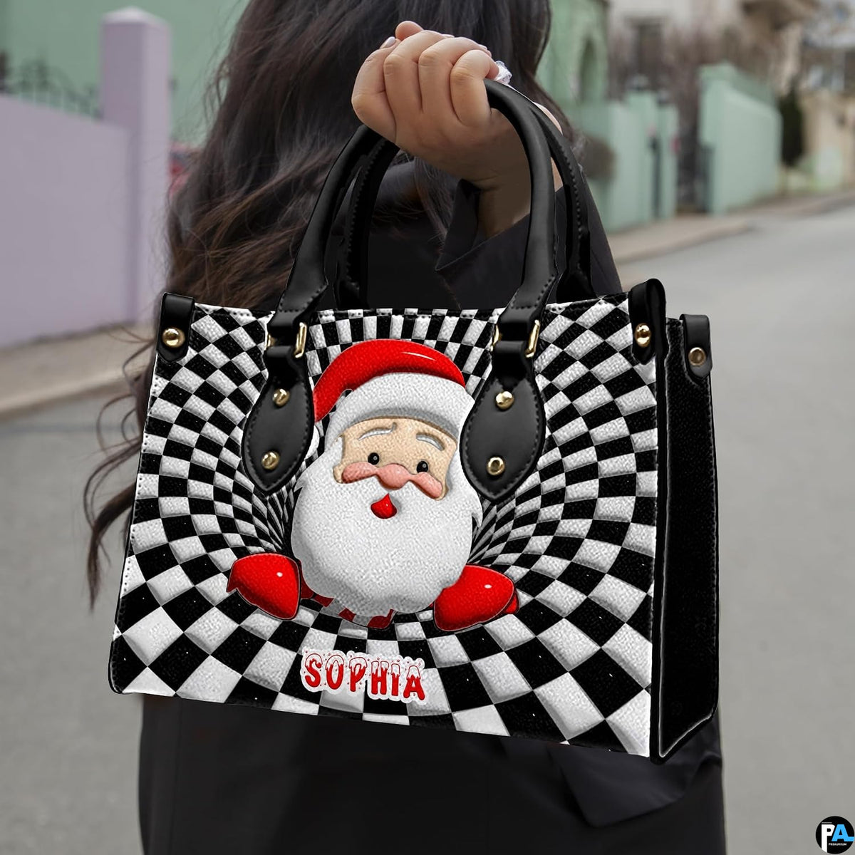 Lifestyle view showing handheld carry of optical illusion Santa handbag outdoors.