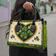 Model carrying clover heart handbag with cream and gold accents