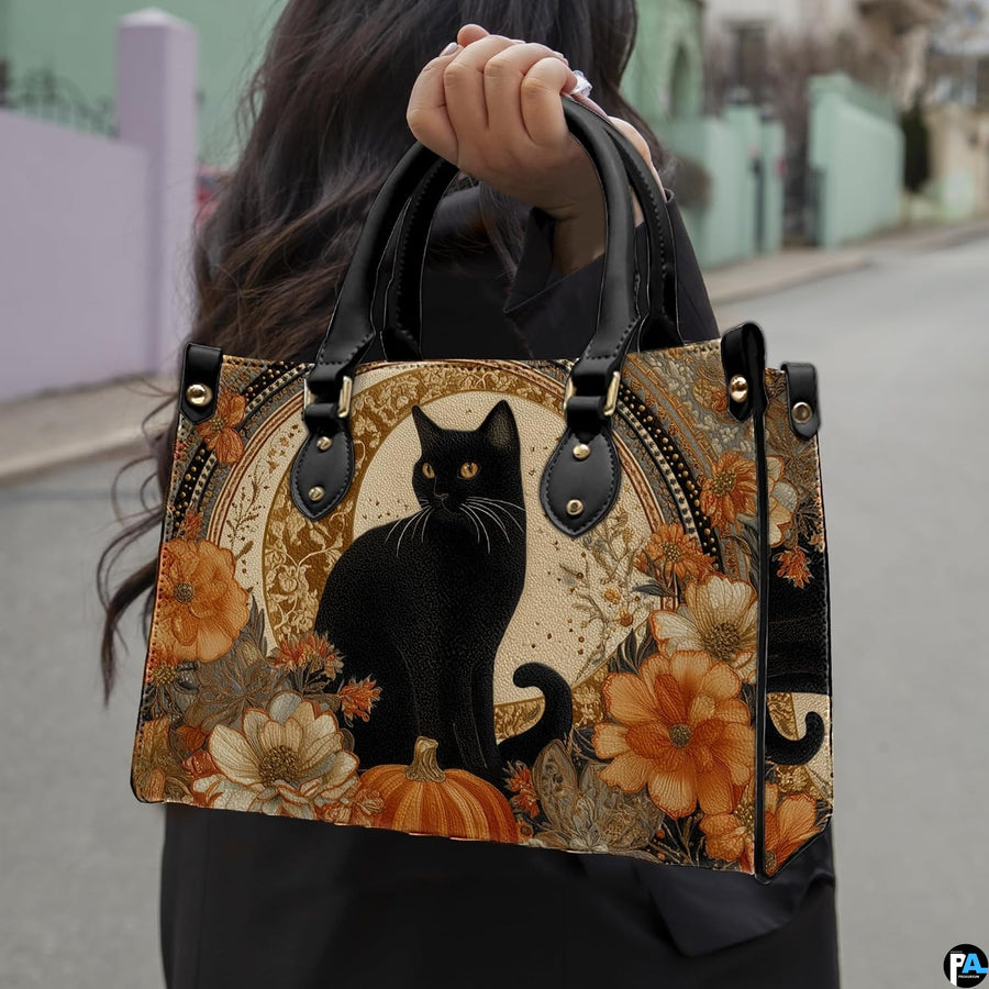 Outdoor street view highlighting the black cat pumpkin art design held in everyday context.
