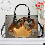 Solid black back view of Virgin Mary devotional handbag with dual top handles