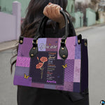 Angled display of purple floral patchwork handbag paired with coordinating wallet.