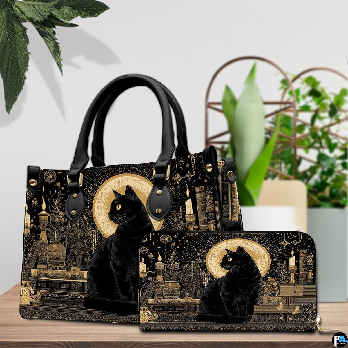 Black cat gothic art resting beside green potted plants on a wooden surface.