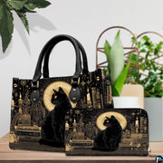 Black cat gothic art resting beside green potted plants on a wooden surface.