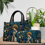 Madonna mosaic sacred art handbag and matching accessory presented on a wooden surface beside greenery