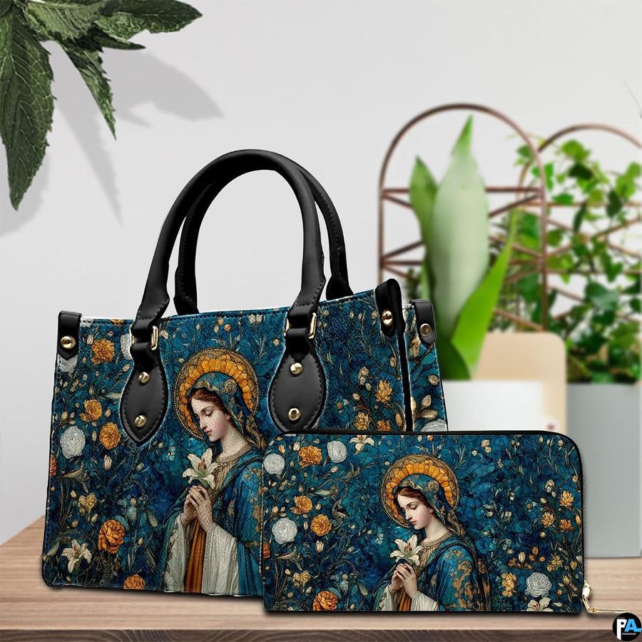 Madonna mosaic sacred art handbag and matching accessory presented on a wooden surface beside greenery