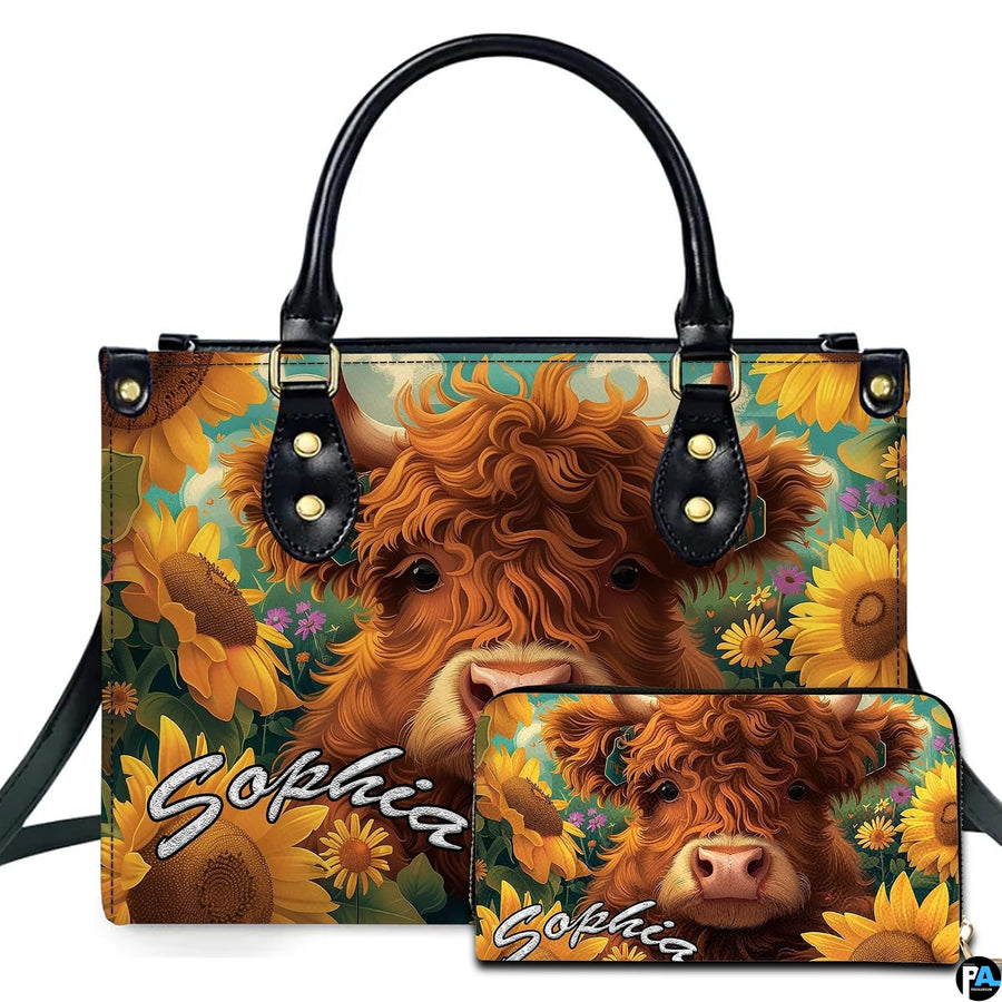 Curly ginger Highland cow calf resting among blooming golden sunflowers under a turquoise sky
