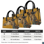 Back view of giraffe handbag displaying continuous golden damask scroll pattern.