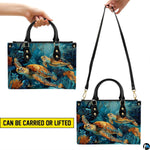 Matching wallet featuring two golden sea turtles gliding amidst aquatic plants.