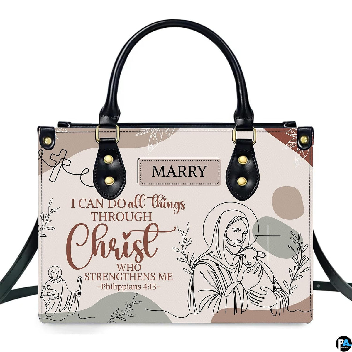 Christian Jesus handbag and wallet displayed on wooden table beside potted plant.