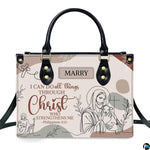 Christian Jesus handbag and wallet displayed on wooden table beside potted plant.