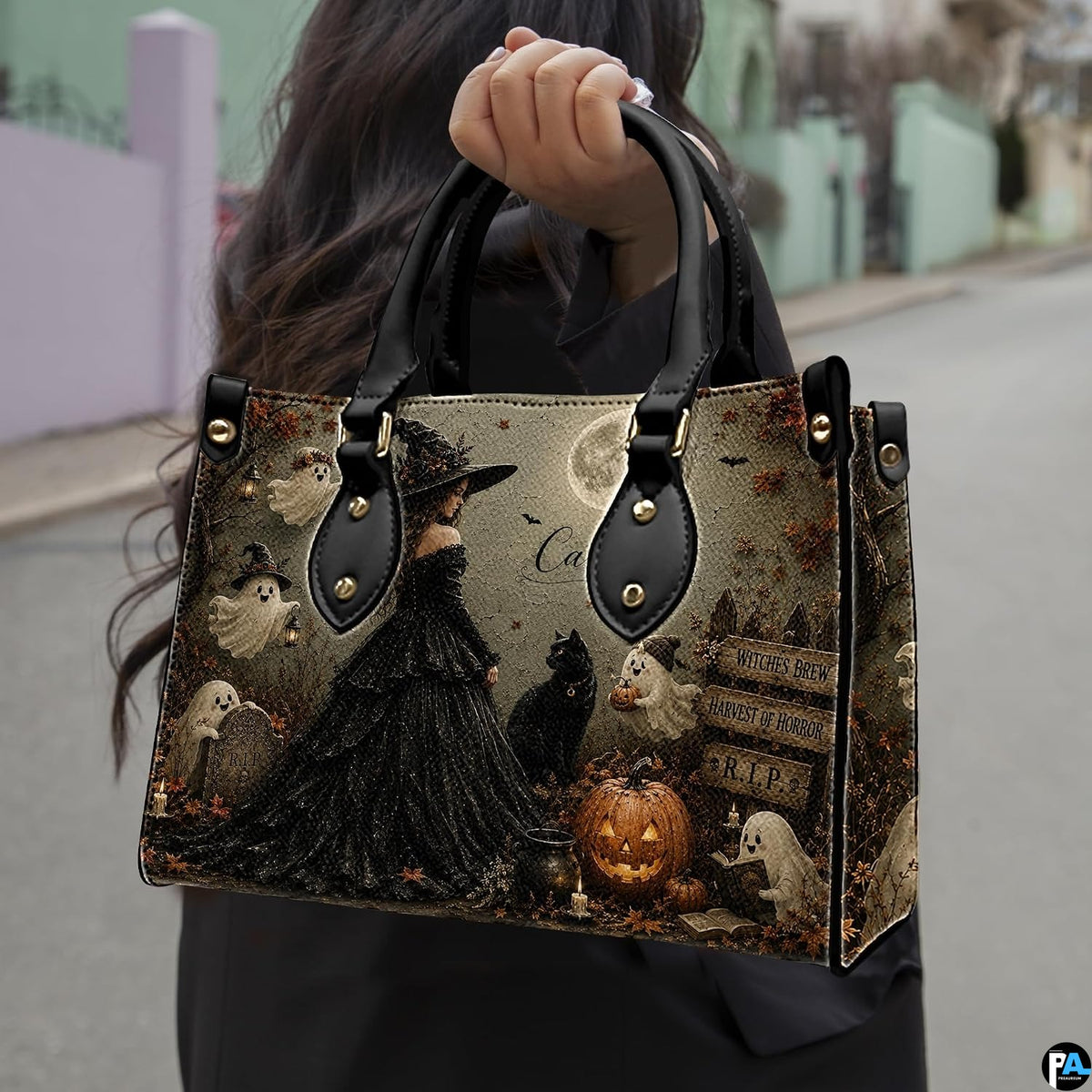 Dark gothic witch art accessory held outdoors showcasing moonlit cemetery scenery, sorceress gown, and ghosts.