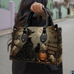 Dark gothic witch art accessory held outdoors showcasing moonlit cemetery scenery, sorceress gown, and ghosts.