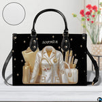 Bottom view of black doctor handbag showing clean flat rectangular base