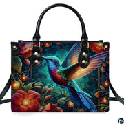 Detailed view of glowing fairy lantern orbs and rich botanical foliage across handbag.