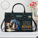 Author blue dragon handbag on white wooden table beside floral vase with texture swatch inset.
