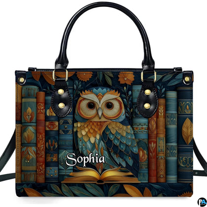 Front view of Scholarly Owl Library Handbag with teal owl perched on open book before antique spines
