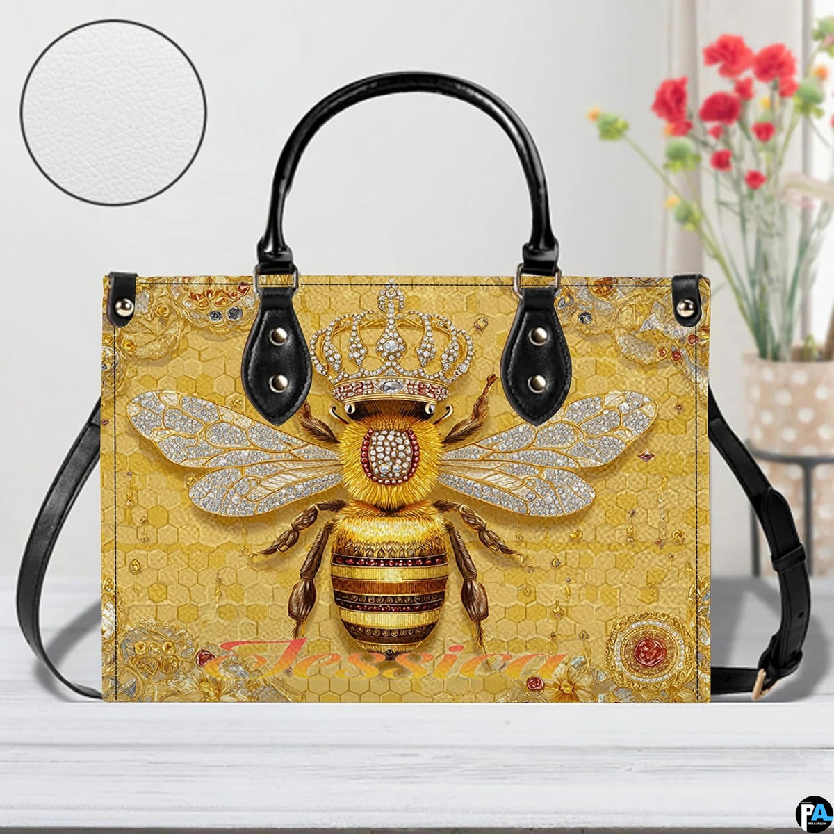Perspective angle view of bee handbag showcasing side depth and continuous honeycomb pattern.