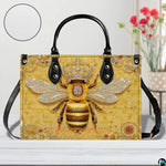 Perspective angle view of bee handbag showcasing side depth and continuous honeycomb pattern.
