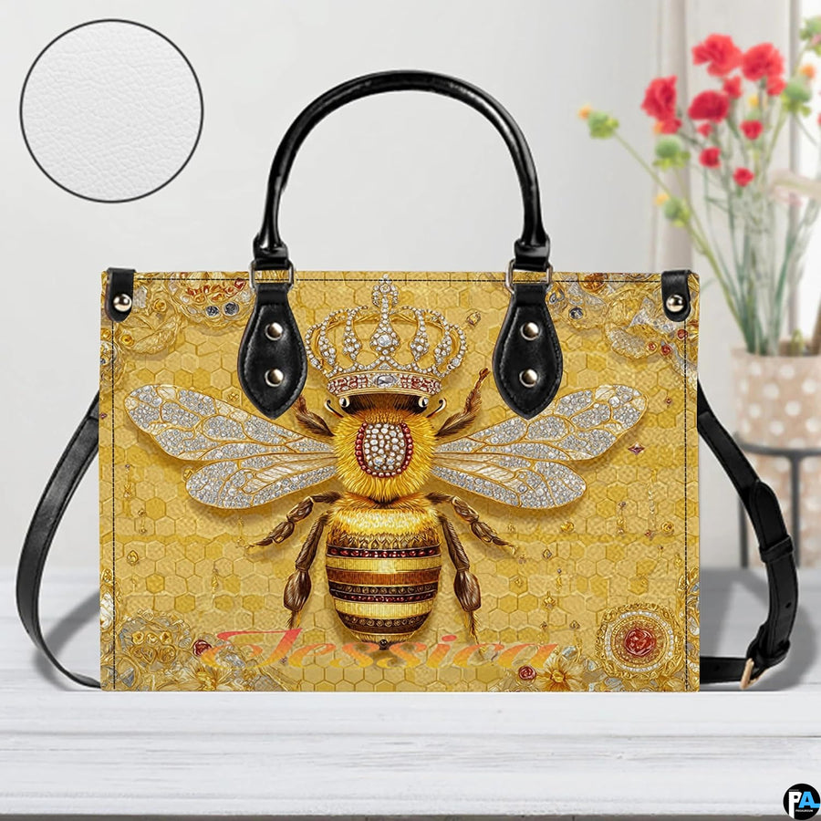Perspective angle view of bee handbag showcasing side depth and continuous honeycomb pattern.