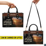 Top angle view showing black carrying handles and main zippered opening of resurrection purse.