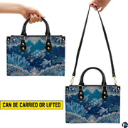 Top-down view of sea turtle handbag showing dual handles and interior storage opening.