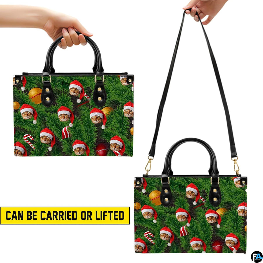 Carrying options demonstrated with top handle carry and shoulder strap wear for Christmas cat handbag
