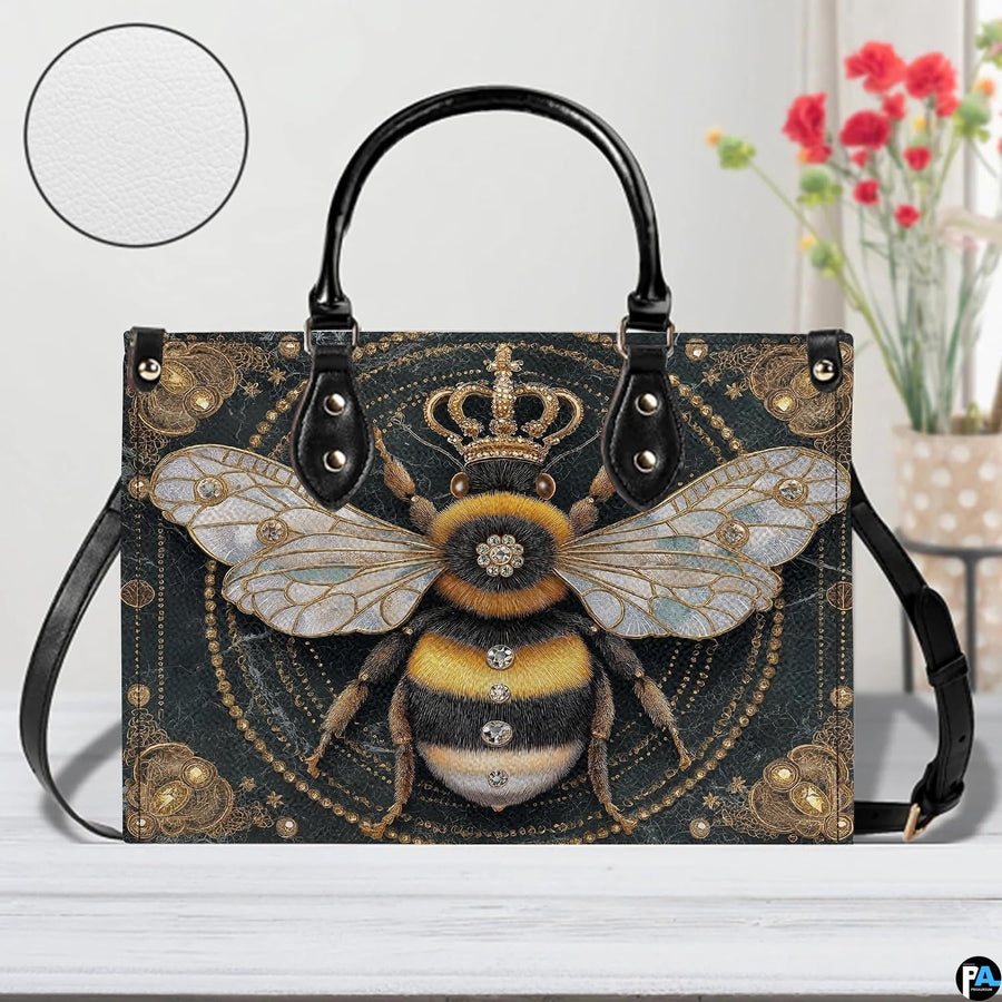 Side profile view showing structured silhouette and black carrying handles of the handbag.