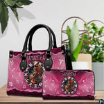 Celestial Archer Satchel Handbag and companion continental wallet displayed beside indoor plant.