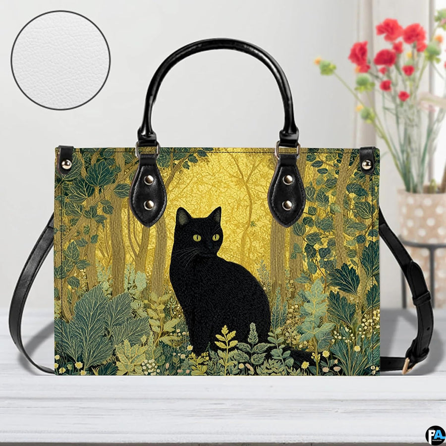Studio perspective of black cat woodland design resting on white painted wood beside floral blossoms.