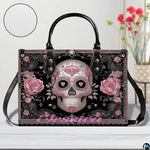 Angle perspective view of the sugar skull handbag showcasing side depth and printed details.