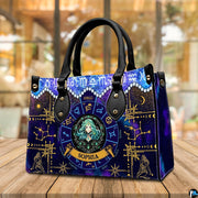 Tabletop perspective of Celestial Maiden Satchel Handbag resting on indoor wooden surface.