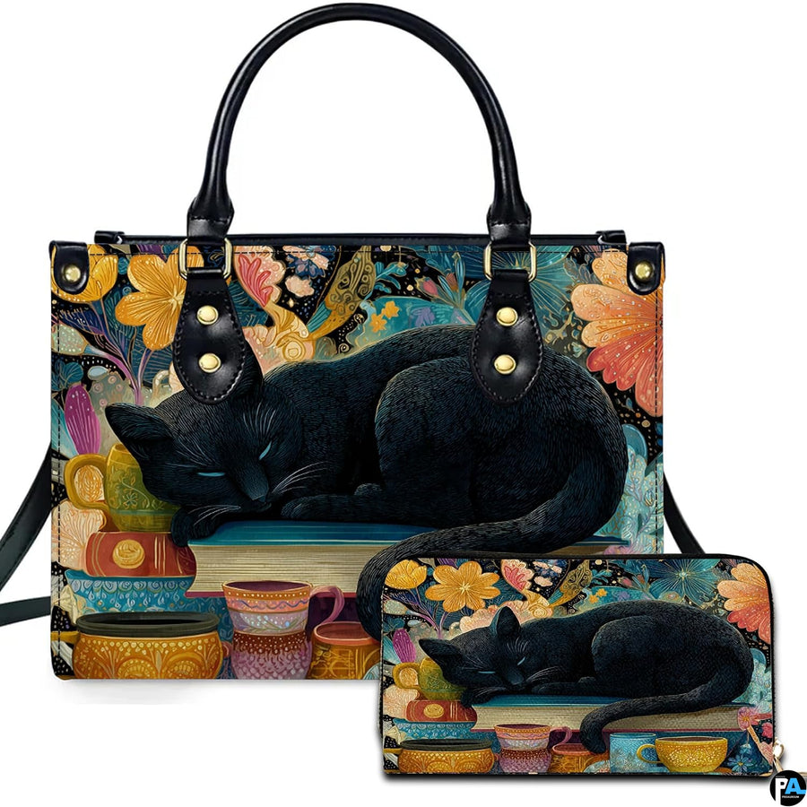 Studio presentation of sleeping black cat art alongside matching rectangular companion accessory.