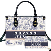 Studio presentation of blue toile floral design beside matching rectangular companion accessory.