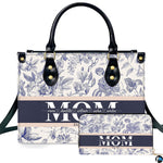 Studio presentation of blue toile floral design beside matching rectangular companion accessory.
