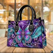Atmospheric view of purple and teal butterfly artwork resting on wooden surface in ambient café setting.