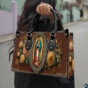 Matching wallet displaying Virgin of Guadalupe devotional artwork with radiant aura and roses
