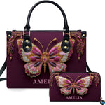 Front view of jeweled butterfly handbag and wallet set featuring pink and gold filigree butterfly on plum
