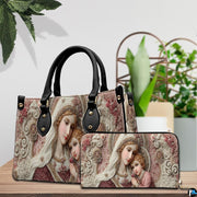 Bottom view displaying flat base and protective metal stud feet of the religious handbag.