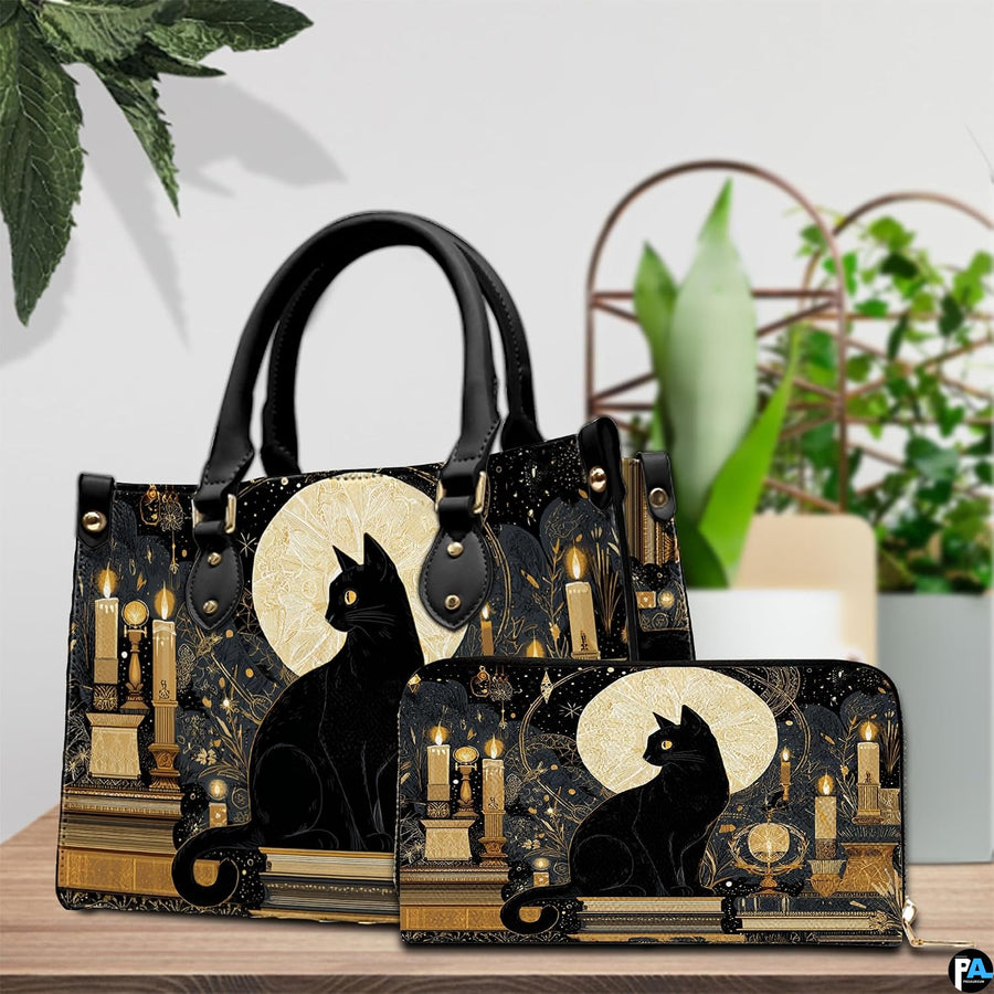 Black cat candles design resting beside potted greenery on a wooden surface.