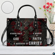 Side profile view of structured gothic crimson rose cross handbag.