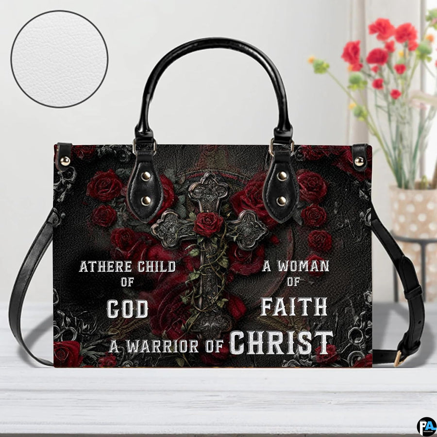 Side profile view of structured gothic crimson rose cross handbag.