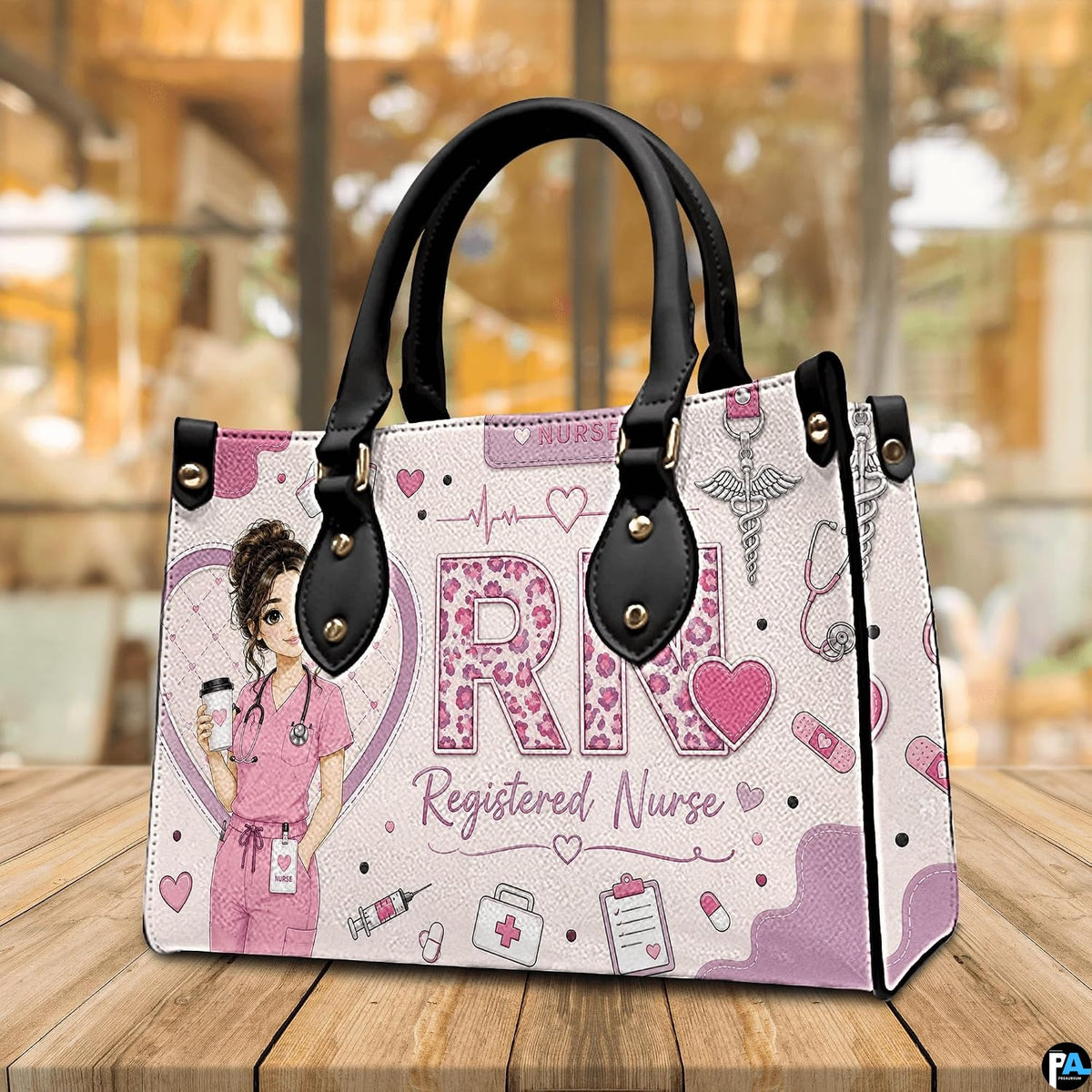 Tabletop showcase featuring pink registered nurse rn art resting on natural wooden surface.