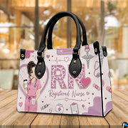 Tabletop showcase featuring pink registered nurse rn art resting on natural wooden surface.
