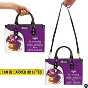 Dual display showing handheld top handle and shoulder strap carrying arrangements.
