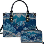 Sea turtle handbag and matching zip wallet displayed against studio background with silver lace details.